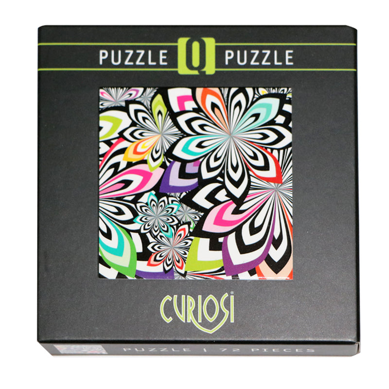 CURIOSI | Produktverpackung des Puzzle Q "Shake 4" mit schwarz-weißem, abstraktem Motiv und bunten Farbakzenten