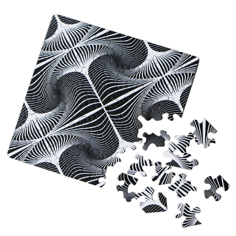 CURIOSI | halbfertiges Puzzle Q "Shimmer 1" mit schwarz-weißem Motiv der optischen Täuschung und außergewöhnlichen Puzzleteilen