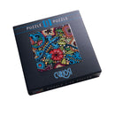 CURIOSI | Produktverpackung des Puzzles Q "Color Mix 3" mit  Salamander und tropischem Untergrund als Motiv