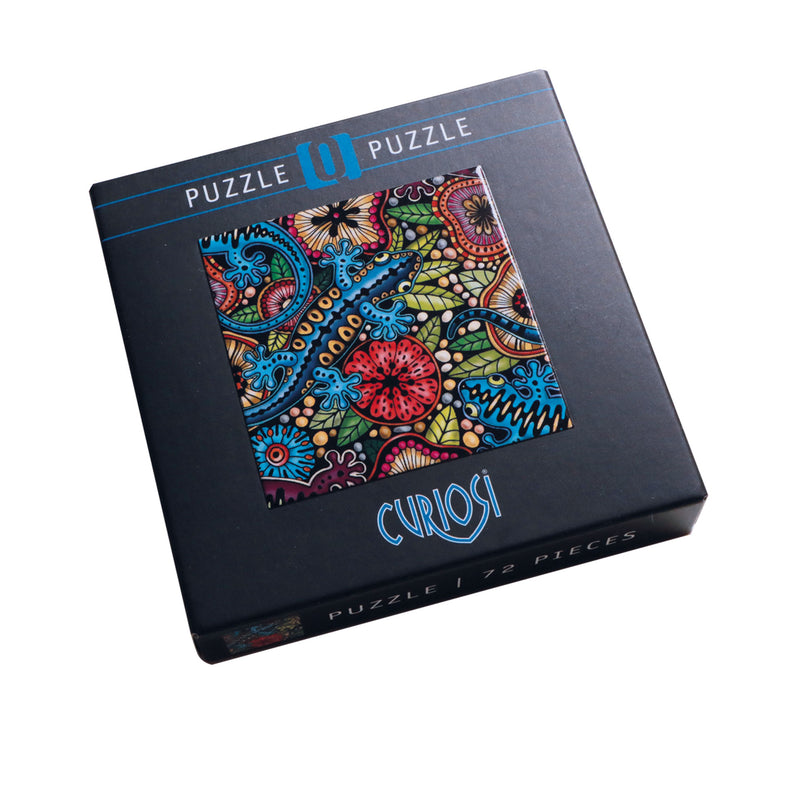CURIOSI | Produktverpackung des Puzzles Q "Color Mix 3" mit  Salamander und tropischem Untergrund als Motiv